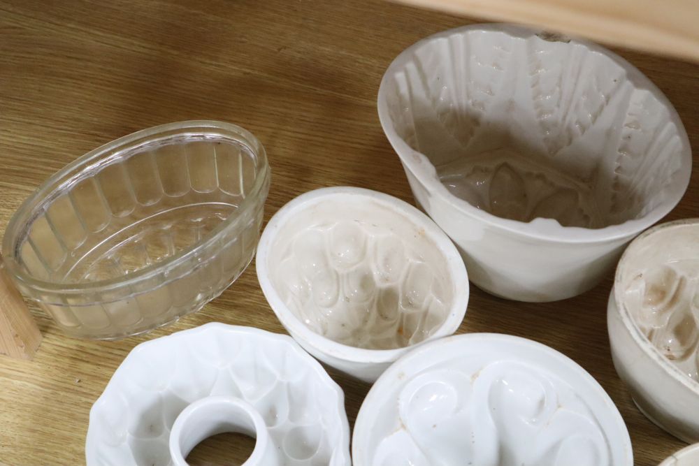 A collection of ceramic and toleware jelly moulds